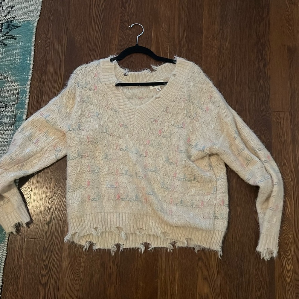 White sweater with blue and pink, size medium